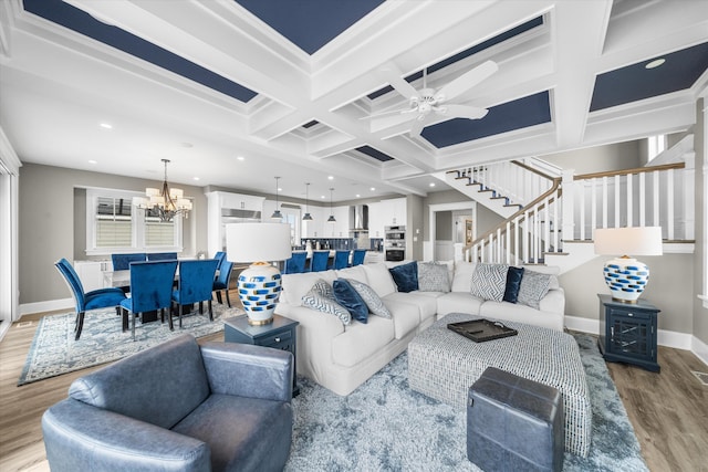 2958 Avalon Ave, Avalon, NJ 08202 - living room featuring coffered ceiling, light wood-type flooring, stairs, a chandelier, and recessed lighting