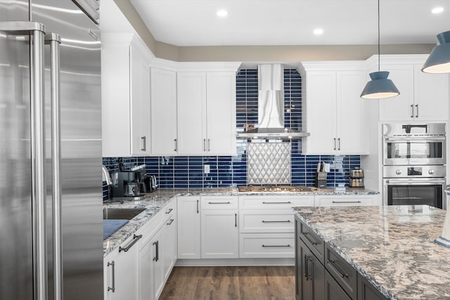 2958 Avalon Ave, Avalon, NJ 08202 - kitchen with appliances with stainless steel finishes, wall chimney exhaust hood, white cabinetry, dark wood finished floors, and recessed lighting