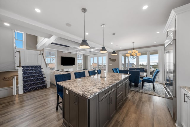 2958 Avalon Ave, Avalon, NJ 08202 - kitchen featuring a kitchen island, recessed lighting, light stone countertops, dark wood-style flooring, and hanging light fixtures