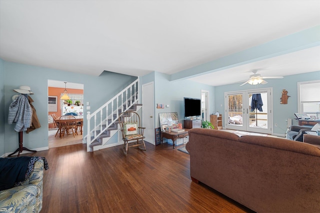 living room featuring baseboards, stairs, a ceiling fan, and dark wood-style flooring