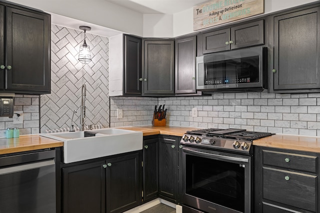 331 Holly Ln, Erma, NJ 08204 - kitchen featuring backsplash, butcher block counters, appliances with stainless steel finishes, and a sink