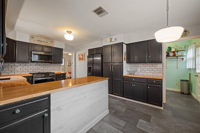 331 Holly Ln, Erma, NJ 08204 - kitchen with decorative backsplash, wood counters, visible vents, and appliances with stainless steel finishes