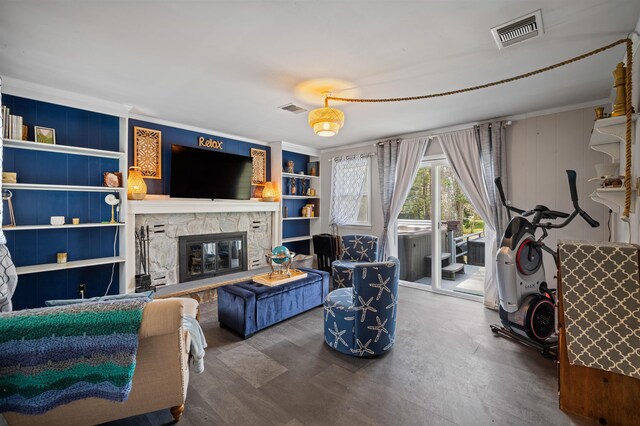 331 Holly Ln, Erma, NJ 08204 - living area with a stone fireplace, visible vents, built in features, and crown molding