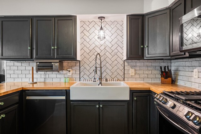331 Holly Ln, Erma, NJ 08204 - kitchen with stainless steel appliances, decorative backsplash, and butcher block countertops