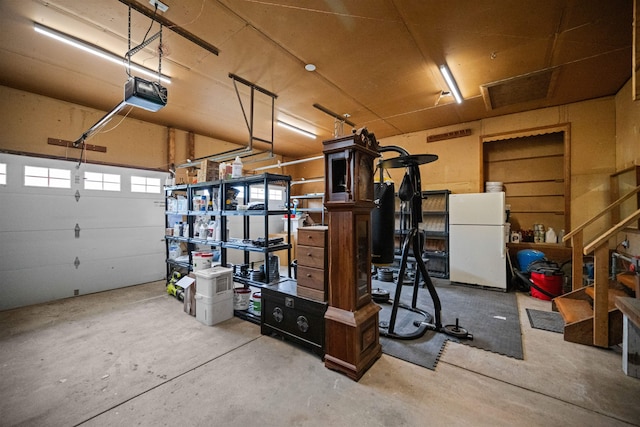 331 Holly Ln, Erma, NJ 08204 - garage with a garage door opener and freestanding refrigerator