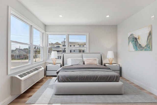 2001 Surf Ave Unit 11, North Wildwood, NJ 08260 - bedroom with wood finished floors, recessed lighting, and an AC wall unit