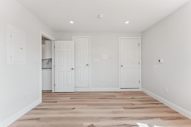 2001 Surf Ave Unit 11, North Wildwood, NJ 08260 - unfurnished bedroom featuring electric panel, light wood-style floors, and recessed lighting