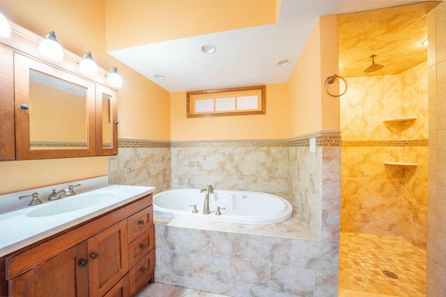 bathroom with tile patterned flooring, vanity, and independent shower and bath