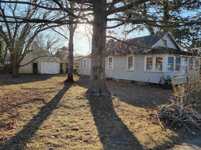 view of home's exterior with an outbuilding and a garage