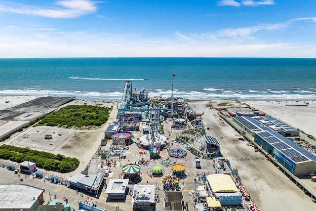 bird's eye view with a water view and a view of the beach