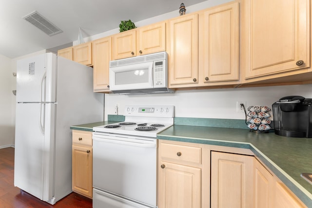 kitchen featuring light brown cabinetry, white appliances, and dark wood-type flooring