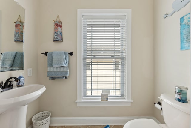 bathroom with tile patterned floors and toilet