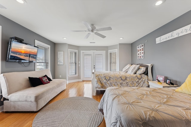 bedroom featuring ceiling fan, french doors, and light wood-type flooring