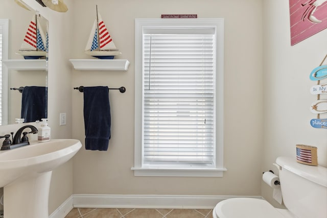 bathroom featuring tile patterned floors, toilet, and sink