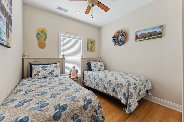 bedroom featuring ceiling fan and hardwood / wood-style floors