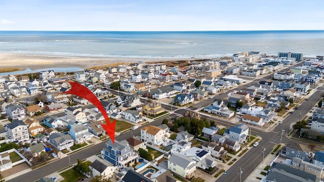 bird's eye view with a view of the beach and a water view