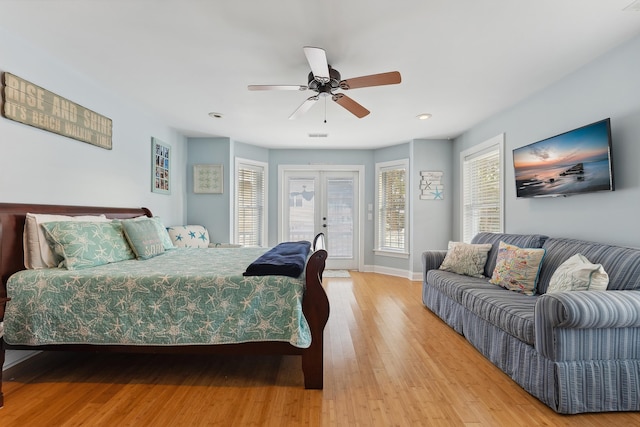 bedroom with ceiling fan, light wood-type flooring, access to outside, and french doors