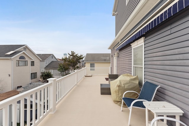 view of patio featuring grilling area and a balcony