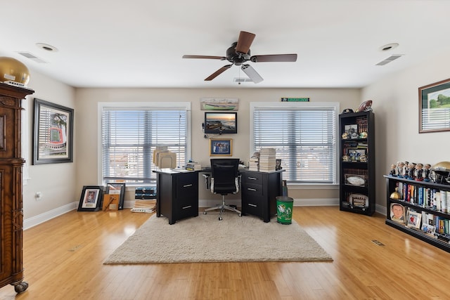 office area with ceiling fan and light hardwood / wood-style flooring