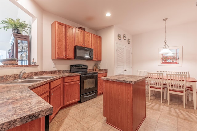 kitchen with black appliances, a center island, sink, and pendant lighting