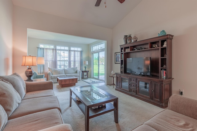 carpeted living room featuring ceiling fan and high vaulted ceiling