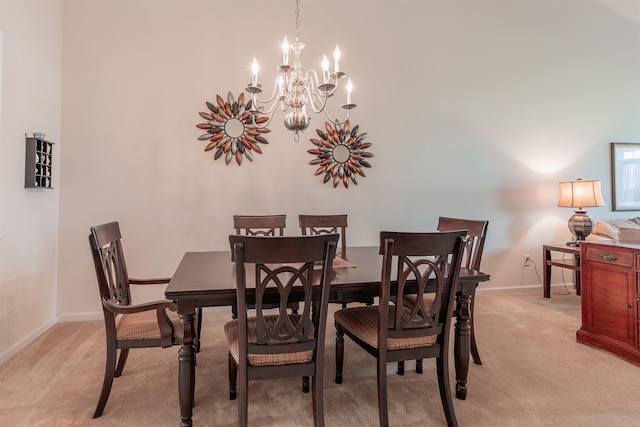 dining room with light colored carpet and a notable chandelier