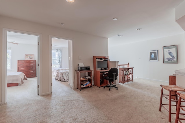 home office with light colored carpet