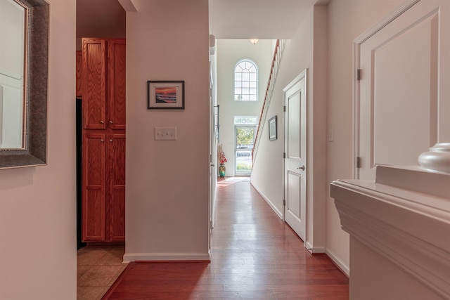 hallway with light hardwood / wood-style floors