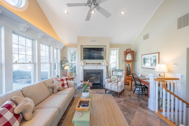 living room with vaulted ceiling and ceiling fan