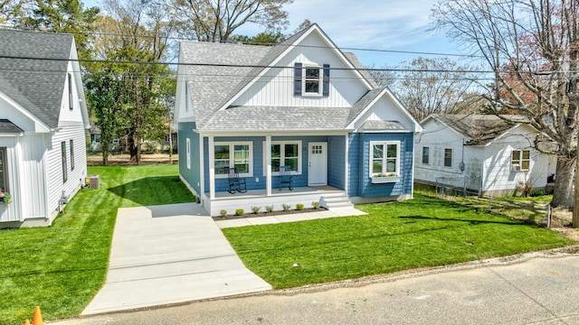 11 Oak Ave, Villas, NJ 08251 - view of front facade featuring a front lawn, roof with shingles, and a porch