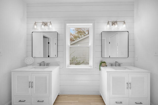 11 Oak Ave, Villas, NJ 08251 - bathroom featuring two vanities, a sink, and wood finished floors