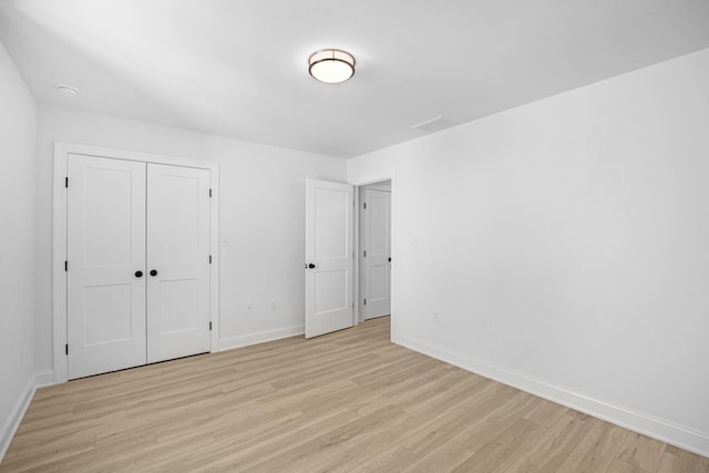 11 Oak Ave, Villas, NJ 08251 - unfurnished bedroom with a closet, light wood-style flooring, and baseboards