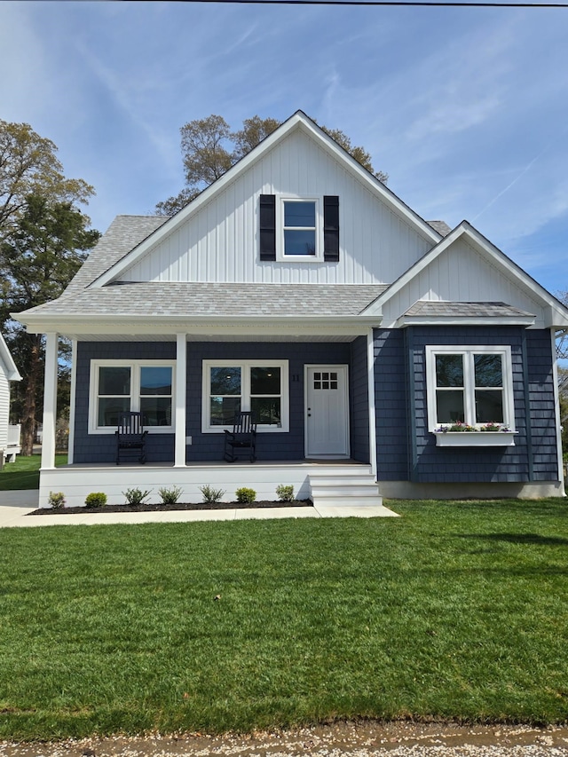 11 Oak Ave, Villas, NJ 08251 - view of front of home featuring a porch, a front lawn, roof with shingles, and board and batten siding