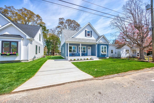 11 Oak Ave, Villas, NJ 08251 - bungalow-style home featuring driveway, roof with shingles, a porch, and a front yard