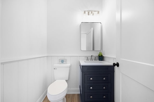 11 Oak Ave, Villas, NJ 08251 - half bathroom featuring wainscoting, wood finished floors, toilet, and vanity