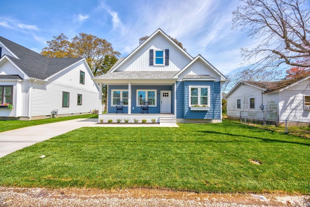 11 Oak Ave, Villas, NJ 08251 - bungalow-style home featuring concrete driveway, a chimney, covered porch, fence, and a front yard