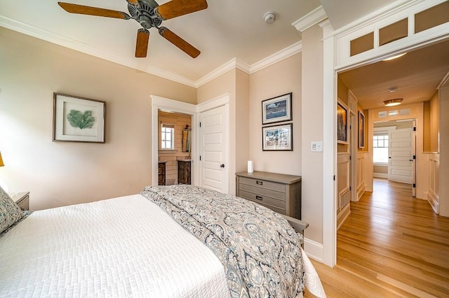 187 104th St, Stone Harbor, NJ 08247 - bedroom featuring light wood-type flooring, ornamental molding, multiple windows, and a ceiling fan