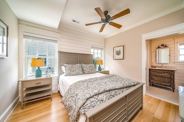 187 104th St, Stone Harbor, NJ 08247 - bedroom with light wood-style flooring, crown molding, ceiling fan, and ensuite bath