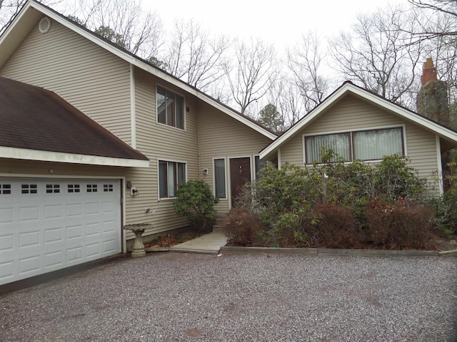 view of front of home featuring driveway and a garage