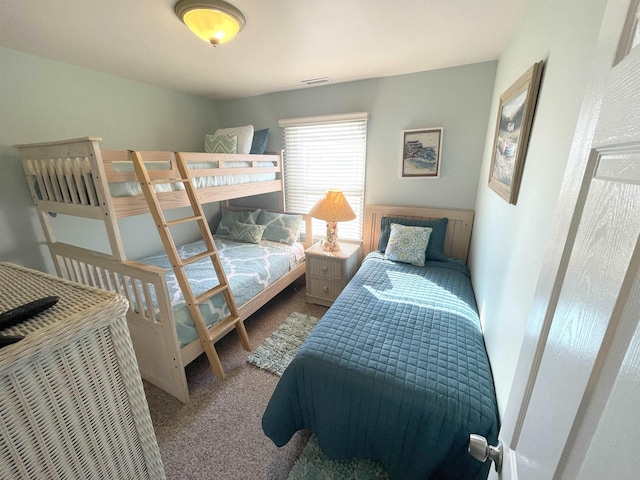 bedroom featuring carpet flooring and visible vents