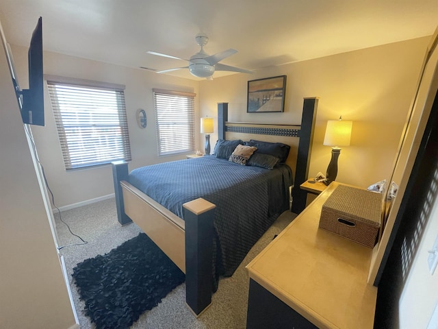 bedroom featuring baseboards, carpet flooring, and a ceiling fan