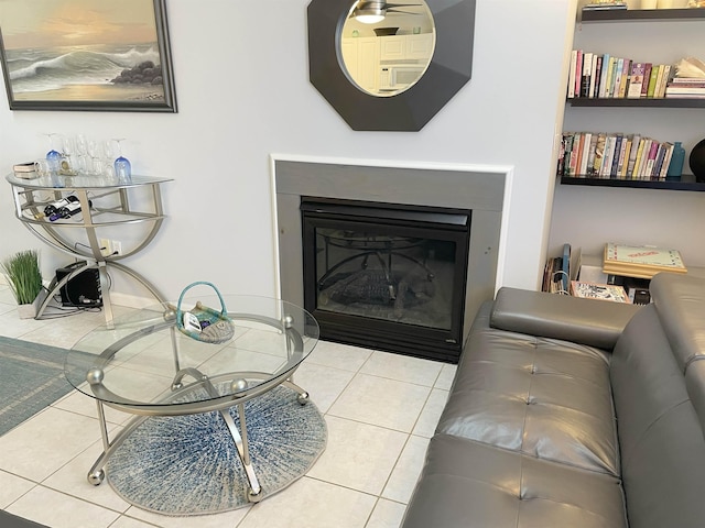 living room with a fireplace and tile patterned flooring