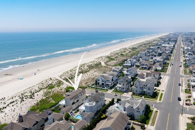 bird's eye view with a view of the beach and a water view