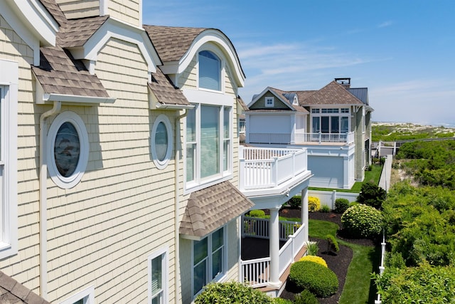 view of property exterior with a balcony