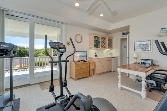 workout area featuring bar area, ceiling fan, and vaulted ceiling