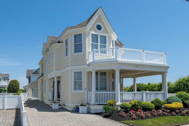 victorian home featuring a garage