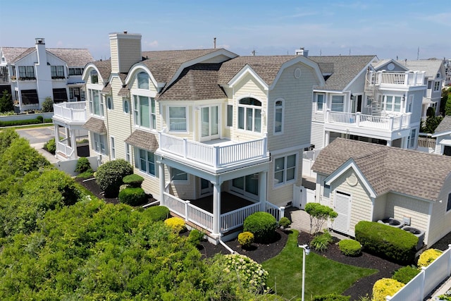 back of house with a balcony