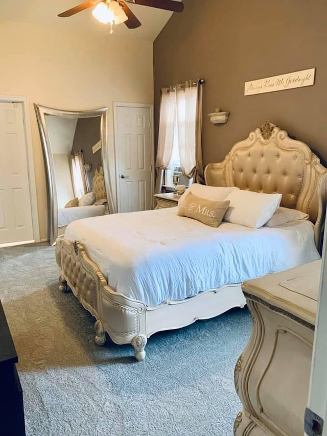 bedroom with ceiling fan, high vaulted ceiling, and carpet