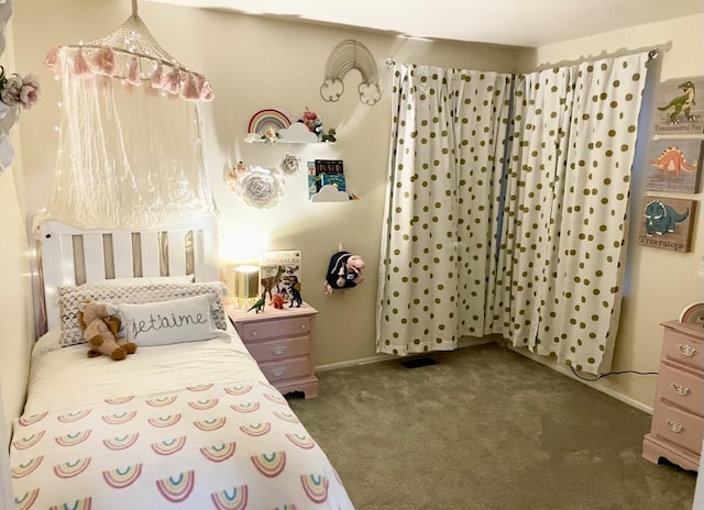 bedroom featuring carpet flooring and baseboards