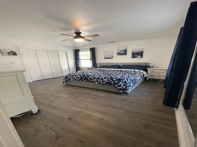 bedroom featuring ceiling fan and dark hardwood / wood-style floors